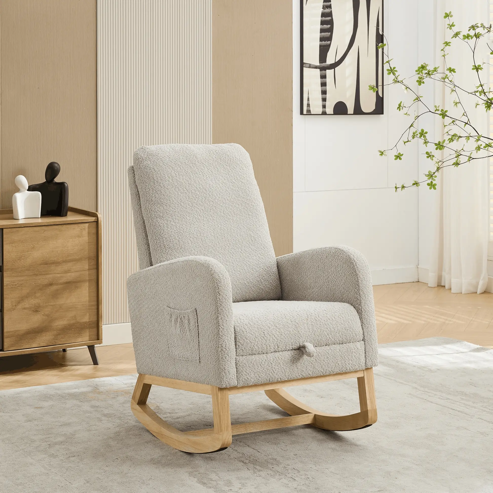 Light gray nursery rocking chair with wooden base in a modern, minimalist baby room