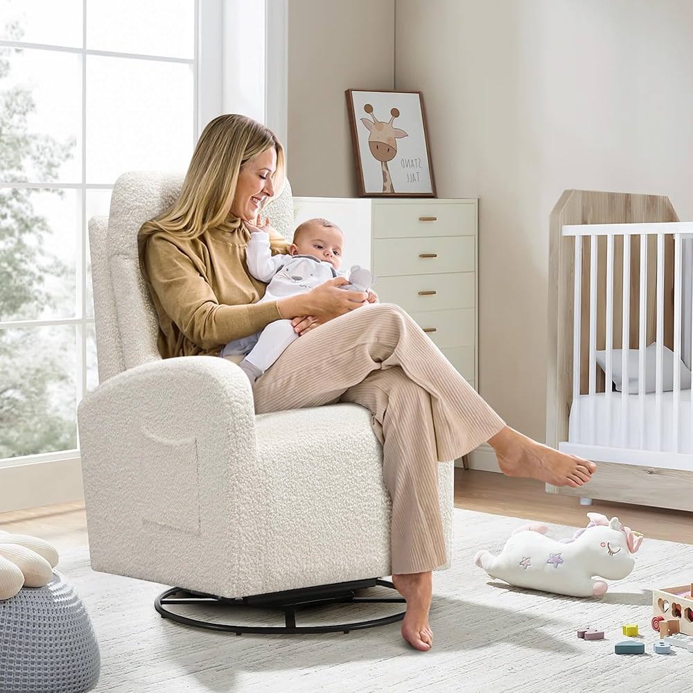 Cream swivel glider chair in nursery with mother feeding newborn — best swivel gliders